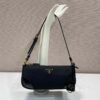 desc_prada-reedition-2002-renylon-and-brushed-leather-shoulder-bag_0